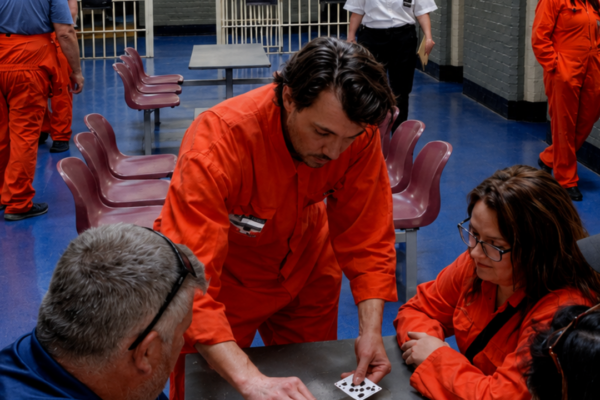 Prison Escape - Shrewsbury Prison - Inmates sat at a table dealing cards with a guard guarding the landing