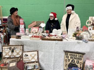 Stallholders selling bespoke gifts at Shrewsbury Prison Christmas Market