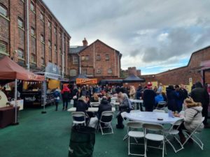 Visitors enjoying food on the food vendors court