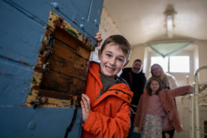 A family on a Self-Guided Tour of Shrewsbury Prison