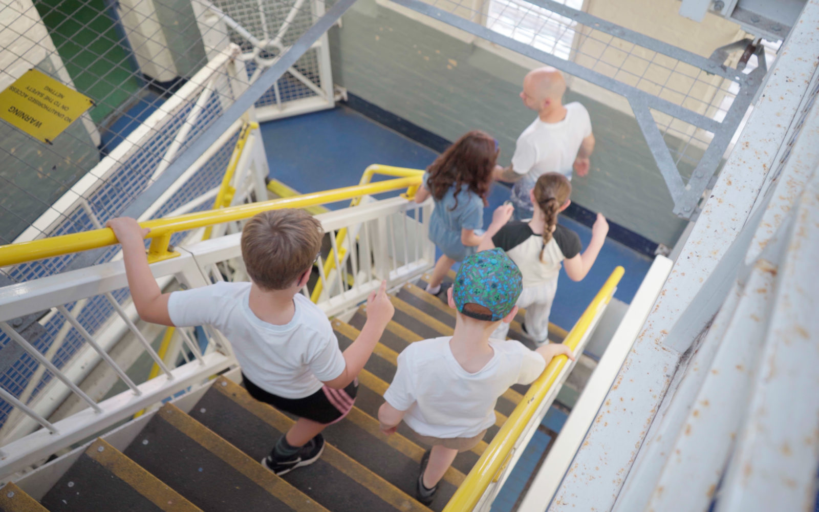 Shrewsbury Prison - Summer Family Offer 2026: Kids Go Free and Eat Free - family with children exploring prison wings