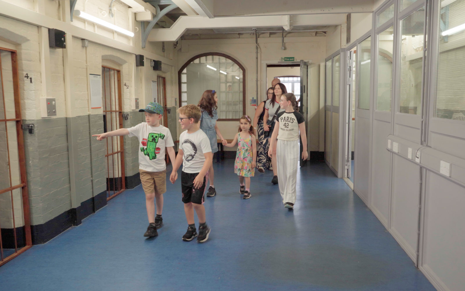 Shrewsbury Prison - Summer Family Offer: Kids Go Free and Eat Free - family with children and friends exploring prison wing