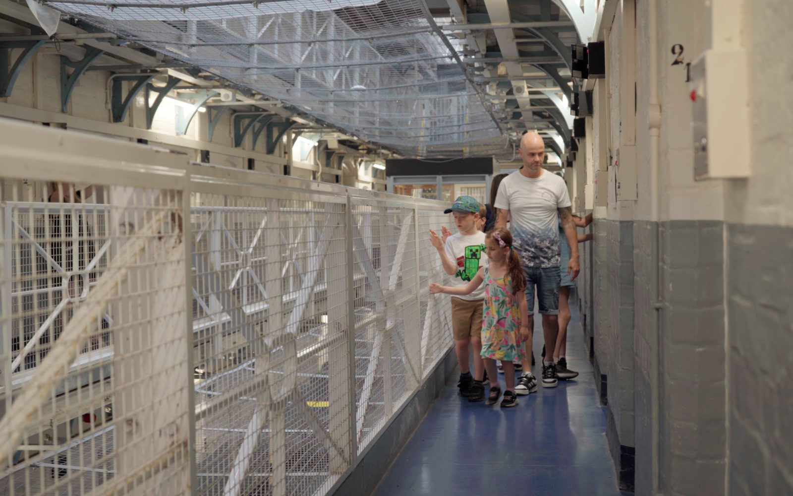 Shrewsbury Prison - Summer Family Offer: Kids Go Free and Eat Free - family with children exploring prison wing