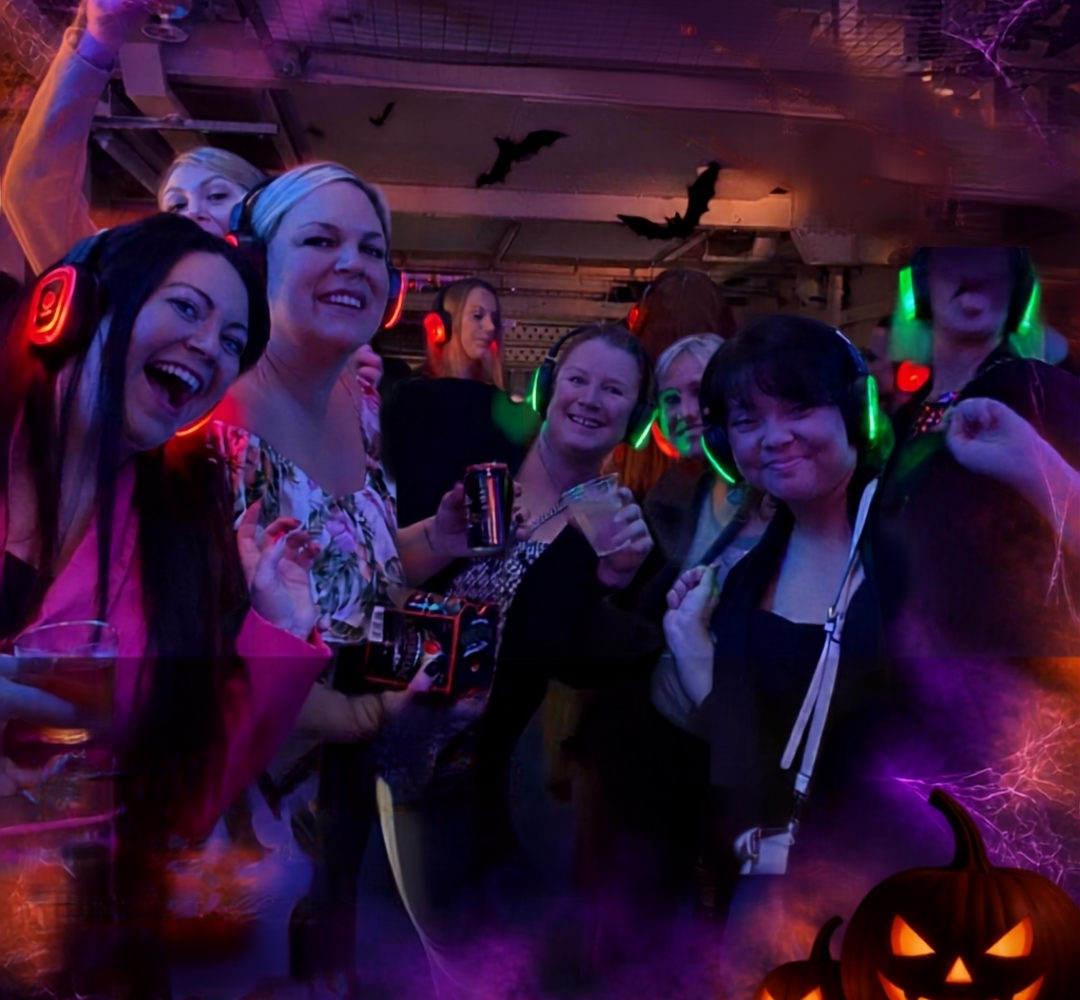 Guests wearing glowing headphones at Halloween Silent Disco in Shrewsbury Prison