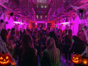 Halloween Silent Disco crowd dancing in A Wing at Shrewsbury Prison
